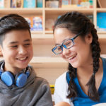 Teenagers reading in the library